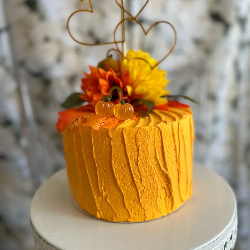 FALLING FOR YOU Vibrant Orange faux Cake with Floral Decoration.